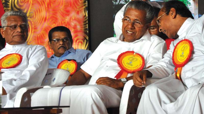 Chief Minister Pinarayi Vijayan having a word with CMI provincial Fr Joseph Vayalil during the 60th anniversary function of St Josephs College, Devagiri, in Kozhikode on Tuesday.	(Photo: DC
