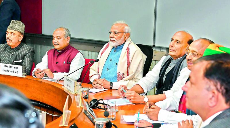 Prime Minister Narendra Modi with parliamentary affairs minister N.S. Tomar (extreme left), home minister Rajnath Singh (extreme right), Congress leader Ghulam Nabi Azad (left) and others leaders at an all party meeting for the Budget session, in New Delhi, on Thursday. (Photo: AP)
