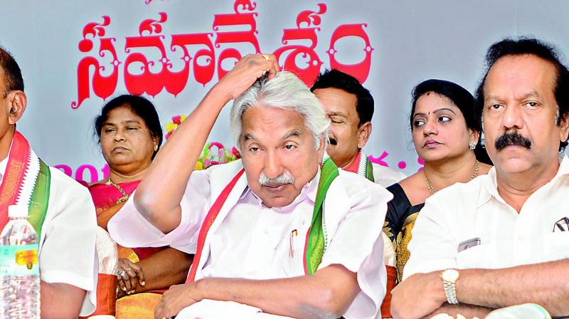 AICC general secretary Oomen Chandy (middle), PCC president N. Raghuveera Reddy and others at the PCC committee and Assembly convenors meeting in Vijayawada on Thursday. (Photo: DC)