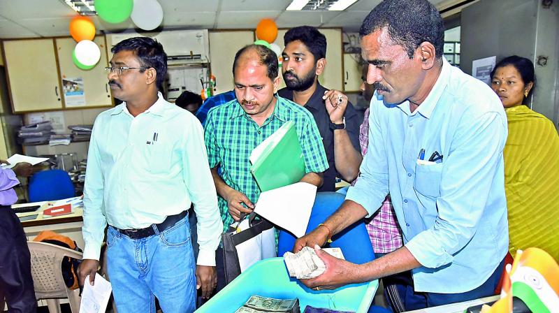 ACB sleuths assess the property found during a raid on the residence of assistant director of Anakapalli mines and archaeology department, Gondu Shivaji (Photo: DC)