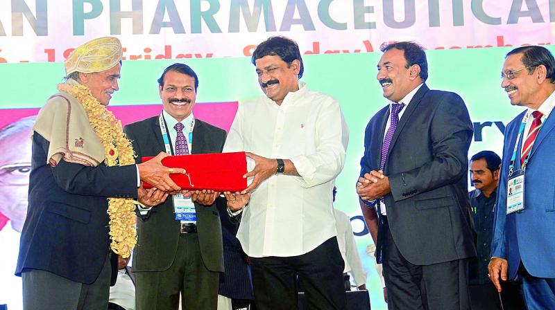 HRD minister Ganta Srinivasa Rao felicitates eminent Pharmaceutical doctors at the inauguration of 68th Indian Pharmaceutical Congress at AU Golden Jubilee Grounds in Visakhapatnam on Friday. 	(Photo: DC)