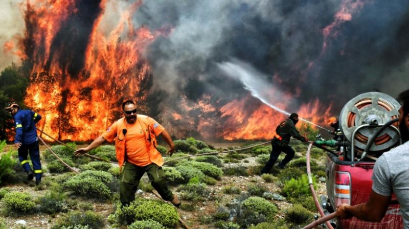 Hundreds of firefighters, as well as several aircraft and helicopters have been mobilised to fight the fires in Greece. (Photo: AFP)