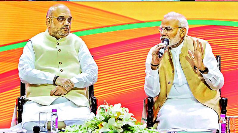 Prime Minister Narendra Modi and BJP president Amit Shah during the BJP National Executive meeting in New Delhi on Sunday. (Photo:PTI)