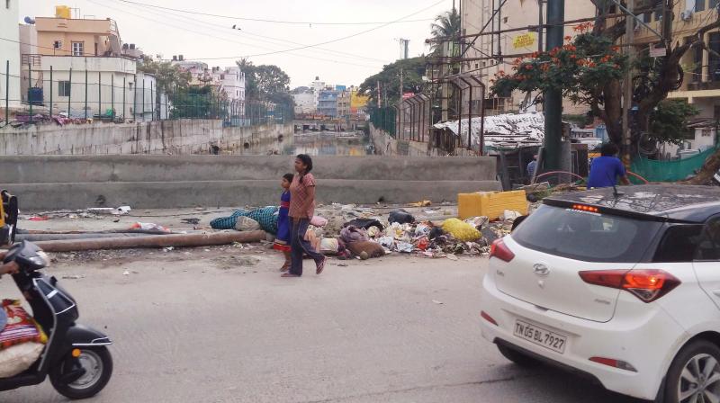 Debris dumped on the footpath near Adugodi Junction (Image DC)