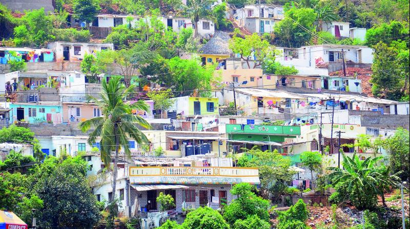 Houses constructed amidst hills near Aarilova and Hanumantawaka in Visakhapatnam. (Photo: DC)