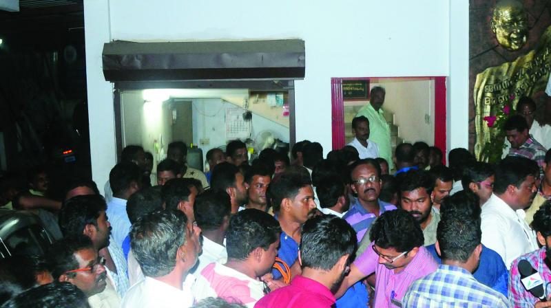 People gathered at the Kalamassery area committee office of CPM after the reports that CPM leader Zakir Hussains arrest was imminent. (Photo: DC)