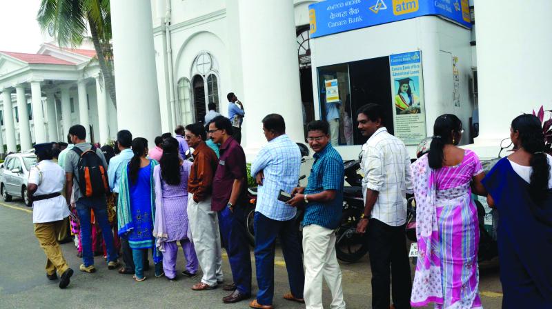 Secretariat staff queuing at an ATM counter in secretariat complex on Monday. (Photo:  DC)