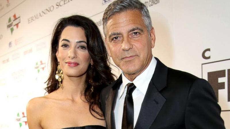 George Clooney and wife Amal.