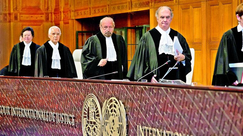 Judges enter to read the world courts verdict in Jadhavs case, in The Hague, Netherlands on Thursday.