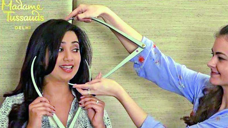 Shreya Ghoshals measurements being taken for her wax statue