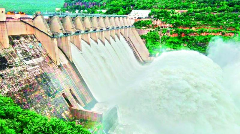 Eight spillway gates of Srisailam reservoir were lifted on Thursday after heavy inflows. (Image Dc)