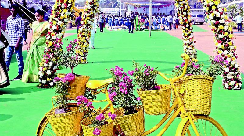 A flower decoration greets visitors to the rose show at Swaraj Maidan in Vijayawada on Friday. (Photo: Dc)