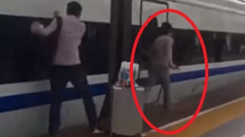 Luckily, the commuter was able to get his finger out of the door before the train station ended. (Photo: Youtube)