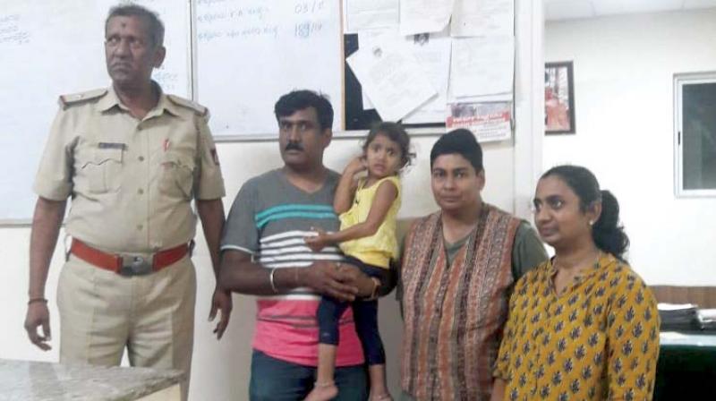 Manju Mehra (L) with parents of the two-year-old, Girish and Soumya