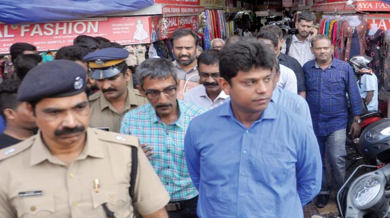 Ernakulam District Collector Mohammad Y Safirulla visits the shops at Convent Junction during  the two-day nationwide general strike, in Kochi on Tuesday (Photo: SUNOJ NINAN MATHEW)