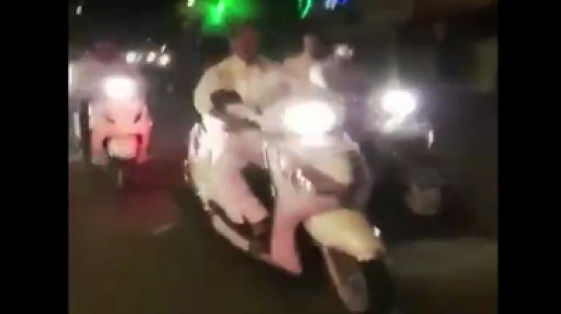 In the video, Bharatiya Janata Partys (BJPs) Das is seen driving a two wheeler without helmet. (Photo: ANI/Screengrab)