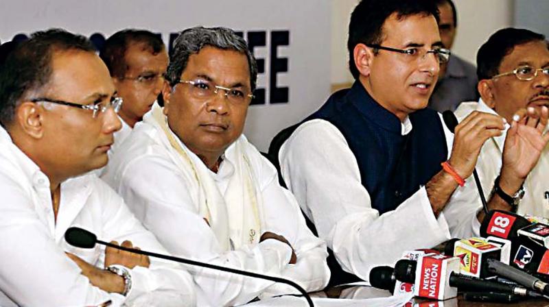 A file photo of KPCC working president Dinesh Gundurao with Chief Minister Siddaramaiah
