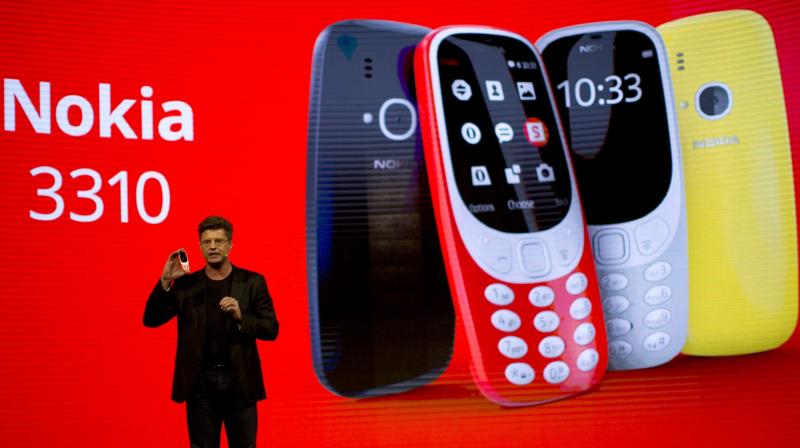 Arto Nummela shows the new re-launched Nokia 3310 (Picture: AP Photo)