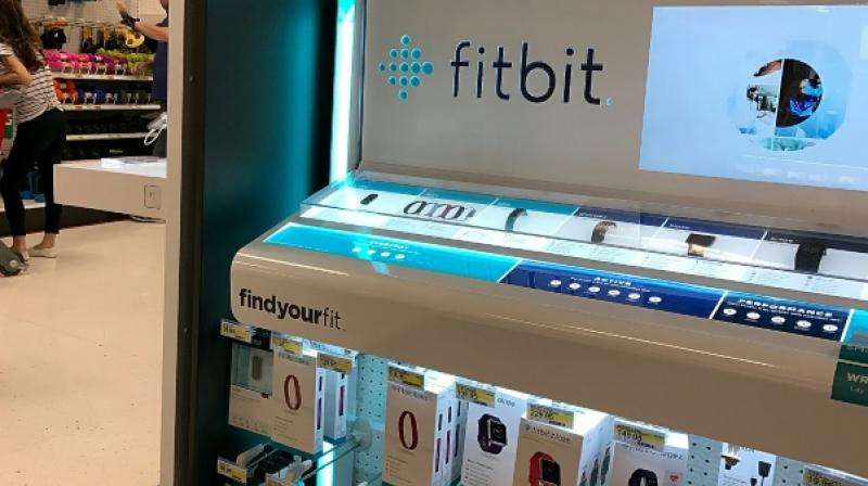 A sale display for the fitness wearable Fitbit is seen at a Target store on January 30, 2017 in Los Angeles, California (Photo: AFP)