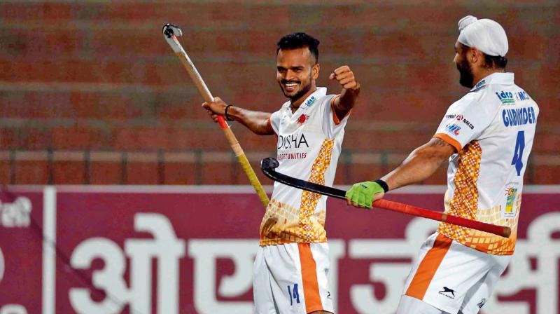 Kalinga Lancers Lalit Upadhyay (left) celebrates his goal  against Jaypee Punjab Warriors in their HIL-5 match in Chandigarh on Saturday. The Lancers won 7-0.
