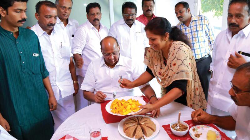 Sheeba Jimmy, wife of late NCP leader Jimmy George, serves food to Sharad Pawar at Jimmys residence at Kollad in Kottayam on Saturday. (Photo: Rajeev Prasad)