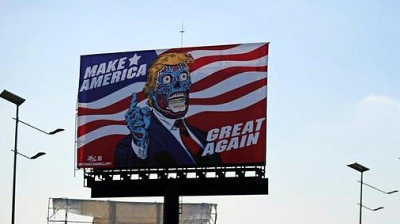 A billboard by US artist Mitch OConnell depicting President Donald Trump displayed in Mexico City is in allusion and tribute to John Carpenters 1988 cult movie \They Live\. (Photo: AFP)