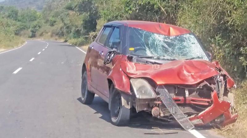 The car that took a battering from the elephant herd near the Dhoomanoor junction on Wednesday. (Photo: DC)