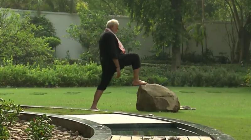 The video shows him meditating, walking on a track inspired by five elements of nature, and doing yoga exercises. (Photo: Twitter/@narendramodi)