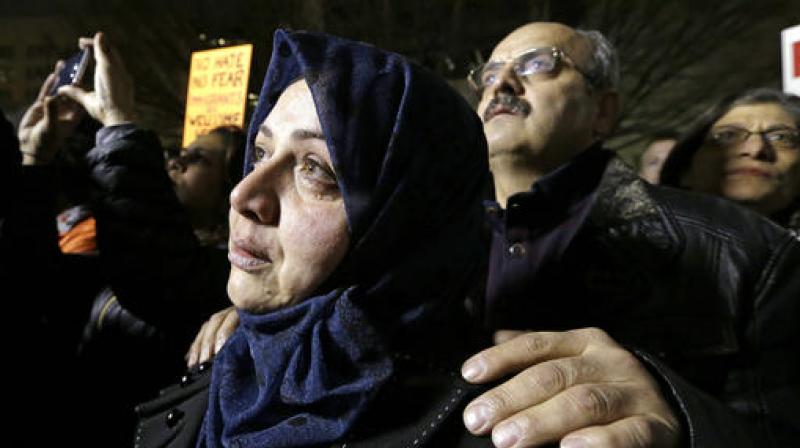 Emtisal Bazara cries as she and her husband, Ahmad Bazara, both recent Syrian immigrants, look on at a rally to oppose President Donald Trumps executive order barring citizens from several countries from entering the United States in Seattle. (Photo: AP)