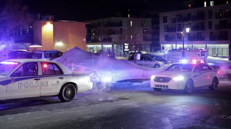 Police survey the scene after deadly shooting at a mosque in Quebec City, Canada. (Photo: AP)
