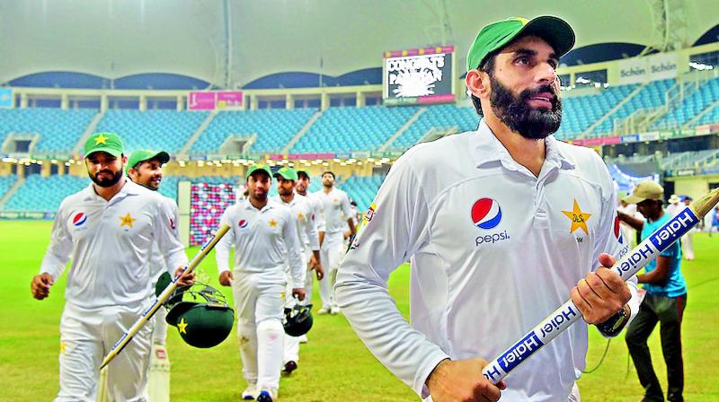 Pakistan skipper Misbah-ul-Haq leads the team off after winning the Test. (Photo: AFP)