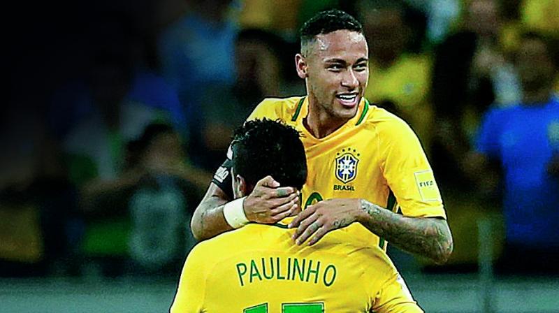 Brazils Neymar celebrates with Paulinho after scoring against Argentina in their 2018 World Cup qualifying match at the Estadio Mineirao in Belo Horizonte, Brazil, on Thursday. The hosts won 3-0. (Photo: AP)