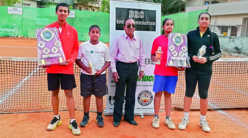 Kota Shashidhar (from left), Vallamreddy Kousik Kumar Reddy, Sanjana Sirimalla and Charitha Vasireddy pose with their trophies alongside TSTA treasurer D. Chandra Sekhar (centre).