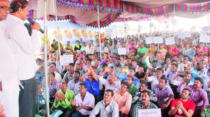 AgriGold victims stage dharna near Alankar Chowk demanding sto olve their problems in Vijayawada on Monday. (Photo: DC)