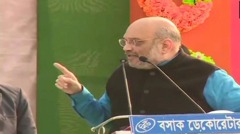 Shah said, I am assuring you, bring BJP and we will not let any infiltrators enter Bengal. But these people love infiltrators that is why they go against us when we talk about NRC. (Photo: ANI | Twitter)