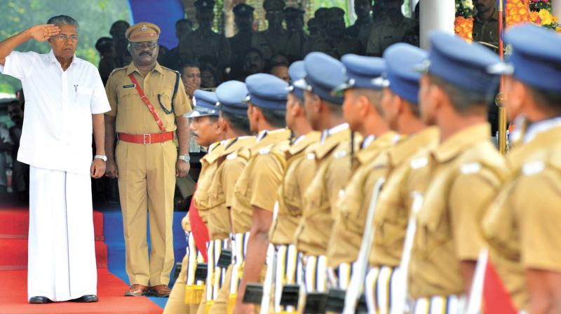 Chief Minister Pinarayi Vijayan receives salute at the march past during the passing out parade at the Police Academy in Thrissur on Monday. 	(Photo: DC)