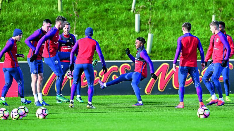 England players go through the paces at St Georges Park in Burton-on-Trent on Thursday, the eve of their World Cup Group F qualifier against Scotland. (Photo: AFP)