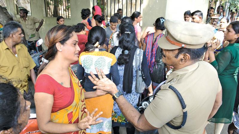 A transgender argues with a cop during a protest in front of the city police commissioners office on Thursday seeking action against those responsible for death of transgender Taara. (Photo: DC)