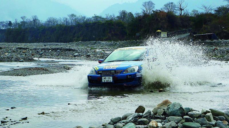 A rallyist traverses near the river bed on Thursday.