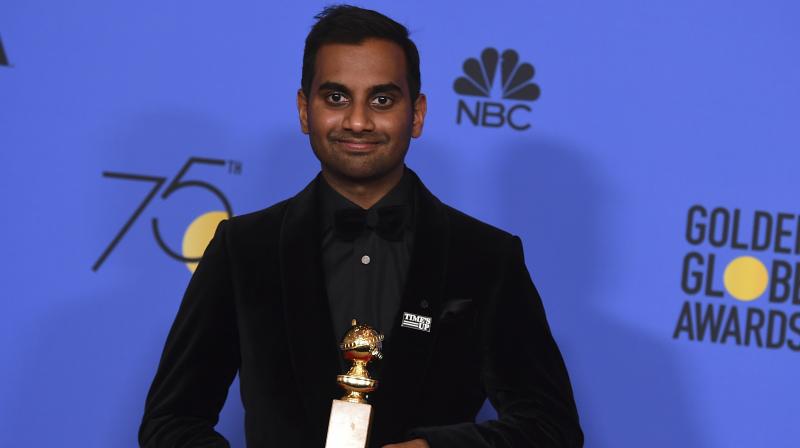 Aziz Ansari with his Golden Globes trophy. (Photo: AP)