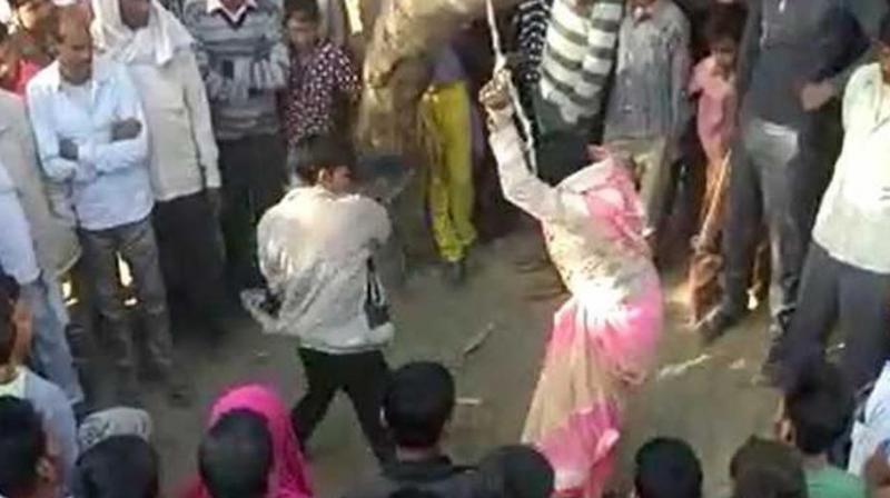 The video shows the husband beating the wife with belts and sticks and with every whip he was heard saying \ab bhaag ke dikha (try to run away now)\. (Photo: ANI | Screengrab)