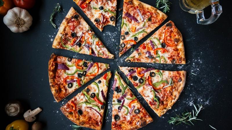 Handing out any kind of free food apparently does not do the trick, the study specifically states that the key to motivating people in the office is by offering them free pizza.