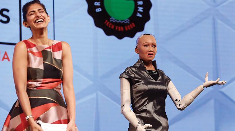Worlds 1st humanoid robot Sophia with actor Kubbra Sait at an interactive session during the International Advertising Association World Congress in Kochi on Friday. 	(ARUN CHANDRABOSE)