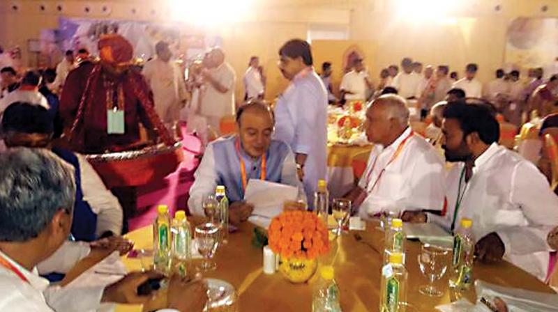 BJP state president B.S. Yeddyurappa and Ballari MP B. Sriramulu with Union Finance Minister Arun Jaitley at the BJP national executive in Bhubaneswar on Sunday.