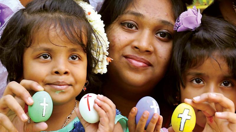 A family celebrates Easter in Bengaluru on Sunday. (Photo: KPN)