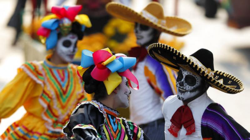 Performers participate in the Day of the Dead parade on Mexico Citys main Reforma Avenue, Saturday, Oct. 28, 2017. (Photo: AP)