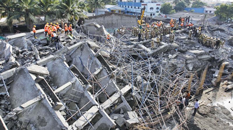 Rescue operations after the building  collapsed, killing 61 workers, in 2014.  (Image DC)
