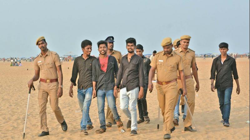 Police rounding up supporters of Tamil Eelam who thronged the Marina beach to observe Mullivaikal remembrance day on Sunday.(Photo: DC)