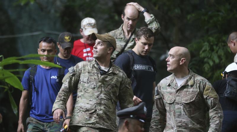 A team of American military personnel from the US Pacific Command, including pararescue and survival specialists, arrived at the site overnight to help rescue operations. (Photo: AP)