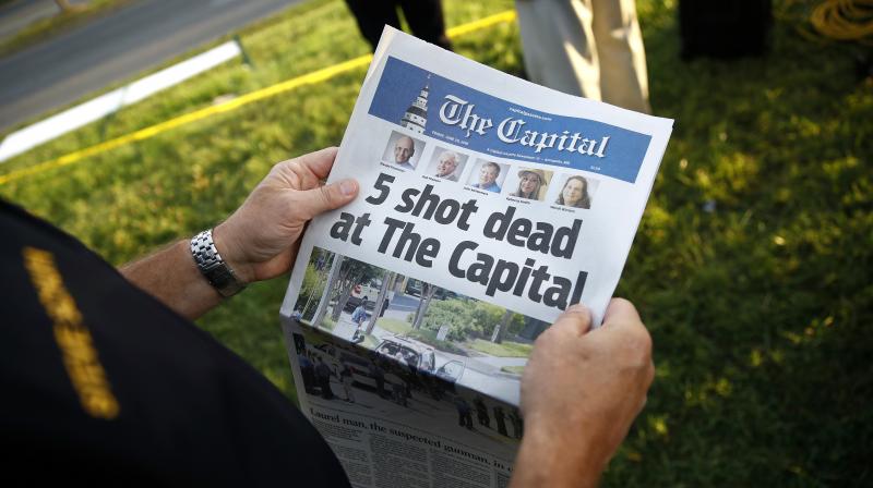 Inside, among the papers blanket coverage of its own tragedy, were profiles of the five staffers gunned down in the latest spasm of Americas epidemic of gun violence. (Photo: AP)